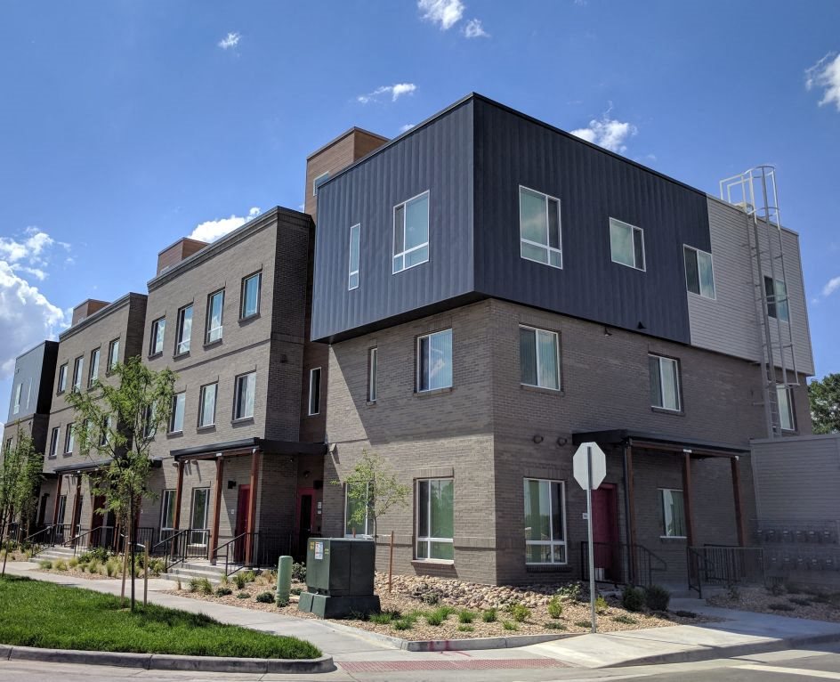 A picture showing A Building and the stop sign near it.